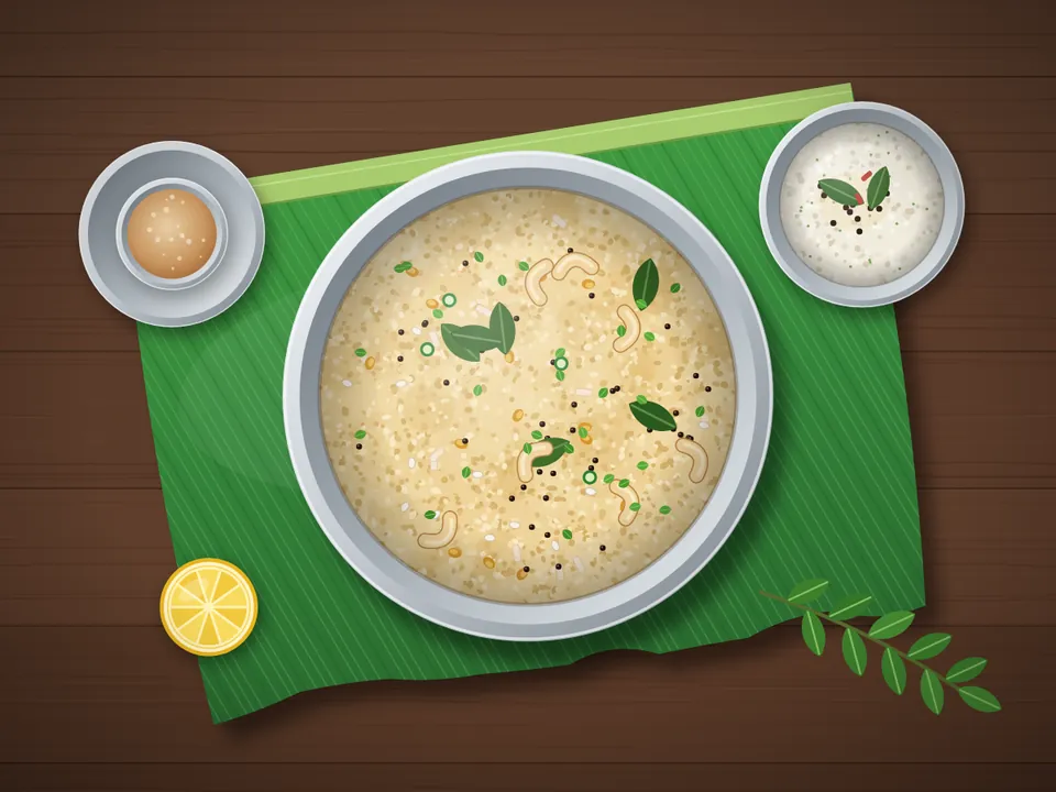 A bowl of rava upma with curry leaves, mustard seeds and cashews on a banana leaf